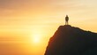 © Wannapha - Person standing on cliff at sunset, serene landscape with warm colors, evokes a sense of adventure and reflection.