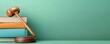 © Nice Seven - A wooden gavel rests on colorful books against a mint green background, symbolizing justice, law, and legal education.