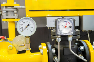 Poster - industrial equipment. pressure gauges on gas pipeline. yellow pipes inside chemical plant. sensors f