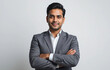 © Arunima Srivastava - Confident Indian entrepreneur standing with arms crossed on white background, Indian businessman wearing a suit standing with arms crossed