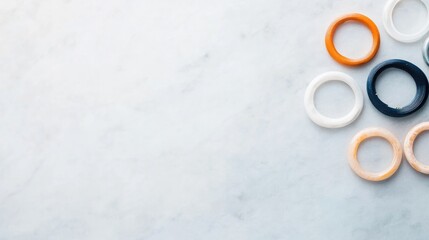 Poster - flat lay of colorful piercing jewelry organized by type on sleek marble background
