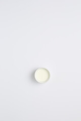 Poster - Minimalist White Aesthetic Simple Bowl of Milk on White Background
