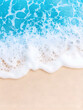 © Nadiyah - Beach waves on golden sand.  A close-up view of foamy turquoise water lapping gently at the shore
