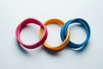 Poster - Colorful fitness bands intersecting at unique angles creating a minimalist design on a white background