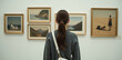 © Happiness  Factory - Young woman appreciating artwork in an art gallery.
