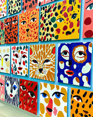 Poster - Vibrant Display of Colorful Xoxo Prints Showcasing Abstract Faces and Playful Patterns