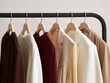 © Natalia - Modern clothes in different colors on hangers