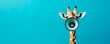 © kirania - A giraffe has a megaphone in front of its face