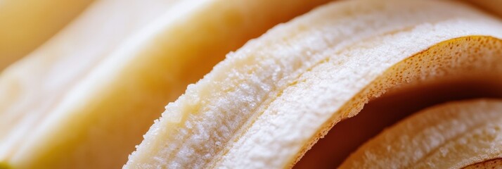 Fototapete - Close up macro shot showcases the intricate texture of sliced banana halves with a soft blurred background for artistic appeal and detail