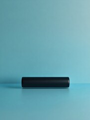 Poster - Fitness roller positioned centrally on a clean blue surface emphasizing a minimalist aesthetic and balance in design