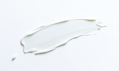Poster - smooth cream smudge on white background, showcasing texture and subtlety. This captures essence of minimalism and simplicity in design