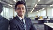 © Mr. Muzammil - Indian businessman in a suit and tie is standing in office