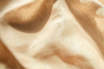 Poster - Textured tan fabric draped in soft folds casting gentle shadows across the surface