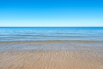 Poster - serene view of peaceful bay with gentle tides and clear blue sky, creating tranquil atmosphere