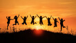 © Lucky Stock - A group of children joyfully jumping on a hill during sunset, silhouetted against a vibrant orange sky, capturing a moment of carefree happiness and freedom