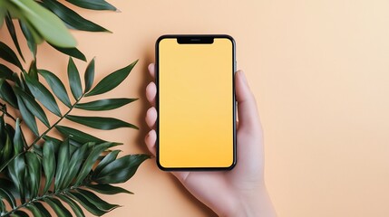 Aesthetic mobile phone presentation with tropical leaf and minimalist backdrop