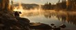 © kirania - A solitary brown bear stands near a misty lake at dawn