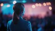 © Роман Варнава - Professional woman speaks to engaged audience at business conference with dynamic stage visuals in evening setting
