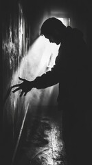 Aufkleber - A person stands in a dark room, illuminated by a faint light from outside