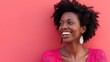 © yang - Joyful African American woman in pink, radiating optimism and cheerfulness