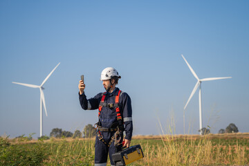 Aufkleber - Engineer man working at windmill farm Generating electricity clean energy. Wind turbine farm generator by alternative green energy.