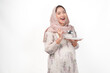 © Reezky - Hungry Asian Muslim pregnant woman holding spoon and plate with copy space.