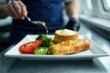 © Yuwadee - Airline meal tray, prepped in industrial kitchen, plane food, catering kitchen, airline food