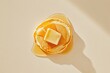 © Anna - Single Pancake Topped With Melting Butter and Syrup on Clean White Background