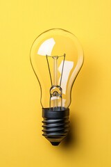 Poster - Single Illuminated Light Bulb, Creative Concept, Innovation, Yellow Background, Copy Space
