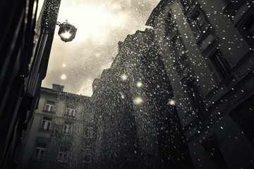 Poster - A black and white photograph of a street light shining through the rain