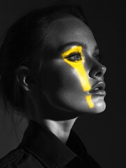 Poster - A woman wearing bright yellow face paint, likely for a costume or festival