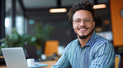 Poster - Portrait of a Successful Young Professional Confidently Working on Laptop in a Modern Office