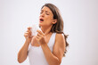 © djoronimo - Portrait of adult woman who is sneezing.