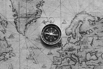 Wall Mural - classic round compass on background of old vintage map of world