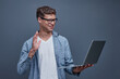 © Katsiaryna - Portrait of happy young business man showing an OK sign isolated