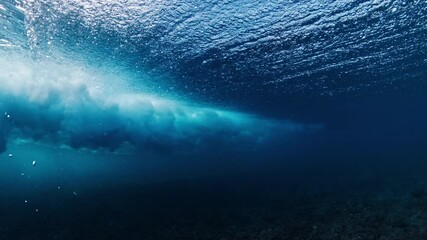 Fototapete - Underwater view of powerful ocean wave. Wave rolls and breaks. Maldives