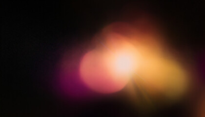 Color light overlay. Defocused yellow-pink radiance soft texture on dark black abstract empty space background. Light in the galaxy with gradient colors on black background.
