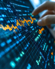 Poster - Close-up of a hand interacting with a tablet displaying dynamic financial data, showcasing fluctuating graphs and numerical figures