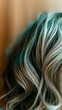 © Vasili - Close-up of teal and blonde colored hair strands with wavy texture. Macro beauty shot displays trendy dyed hair with different shades creating fashionable mermaid-inspired hairstyle concept.