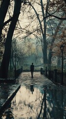 Poster - A person walking in the rain with an umbrella, great for travel or weather related images