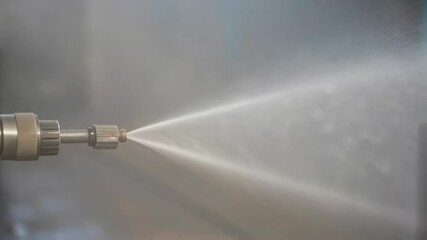Aufkleber - Powerful industrial water spray nozzle generating high pressure stream, demonstrating precision water jet technology within manufacturing environment