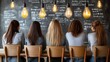 © PANGERANDESIGN - Women seated at a table, facing away, in a cafe with chalkboard background