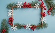© Valfiyy - Festive Christmas and New Year Holiday Frame with Berries and Snowflakes