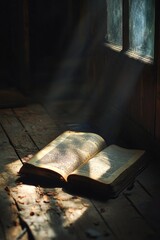 Poster - An open book sitting on a wooden floor