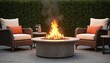 © miss irine - Bright fire pit burns on patio with comfortable chairs. Side table holds wine glass, snacks. Shrubbery creates privacy. Backyard setting invites relaxing, gathering, entertaining evenings. Cozy, warm