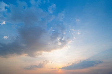 Wall Mural - sunset / sun rise sky with rays of light shining clouds and sky background and texture