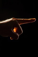 Poster - A person points their finger at something in a dark environment, suitable for use as a mystery or suspense illustration