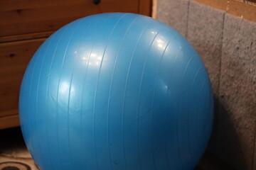 Aufkleber - A blue ball sits on the floor next to a dresser.