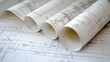 © MohamadIzzudin - Architectural Blueprints Rolled on Table for Design Projects