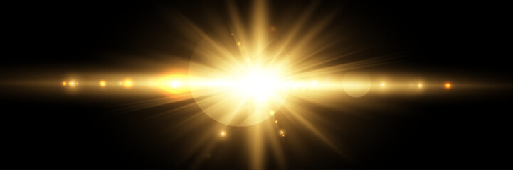 Wall Mural - golden light burst with lens flare on black background